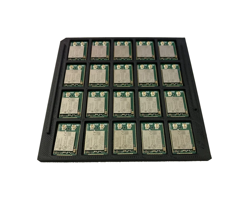 A loaded 5 × 4 tray of nRF9151 Micro Breakout modules